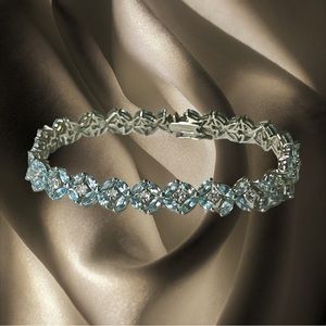 Sterling Silver Blue & Colorless Topaz Bracelet Size 8 1/4 Inches.